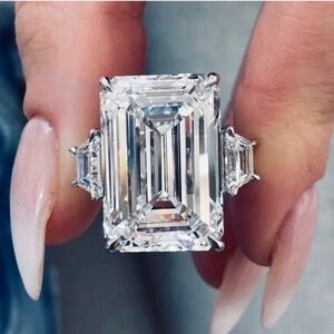 A 10 carat Center diamond with 30 points on the sides Emerald cut GIA CERT